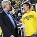 Michigan Governor Rick Snyder chats with a Michigan fan during half time at Crisler Center on Tuesday. Melanie Maxwell I AnnArbor.com